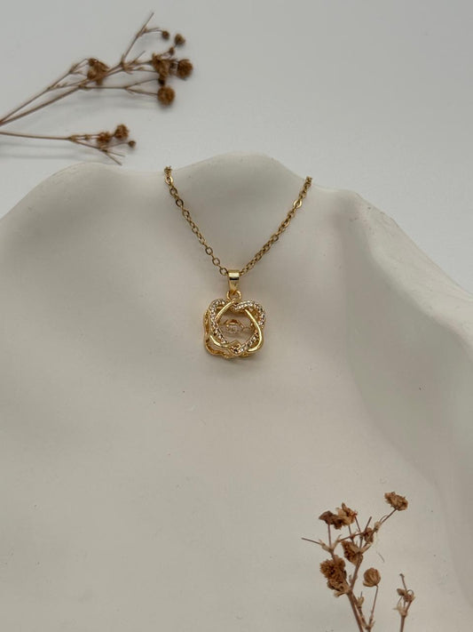 Twistelle – Gold-Toned Crystal Pendant Necklace